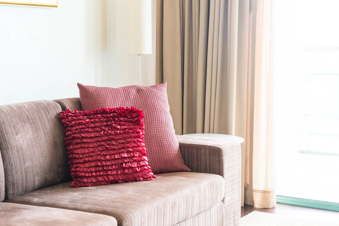 Two pillows on a corduroy sofa