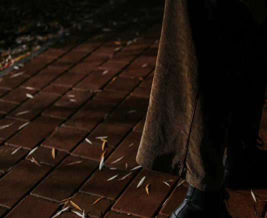 A person wearing brown corduroy