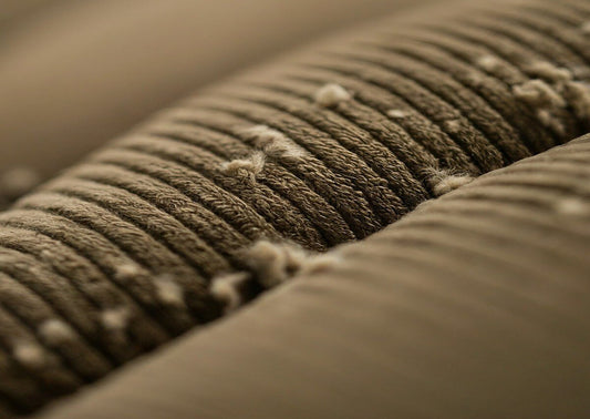 A corduroy couch with pilling